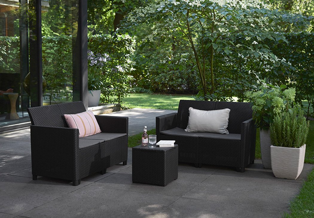 Keter Marie four seater lounge set with storage table with refreshments placed on the table.